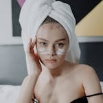 Woman in Black Spaghetti Strap Top Wearing White Hijab